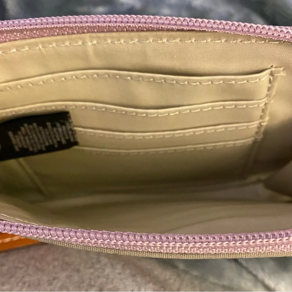 Fossil wristlet pinkish with multicolored dots zippered closure card slots. OSP